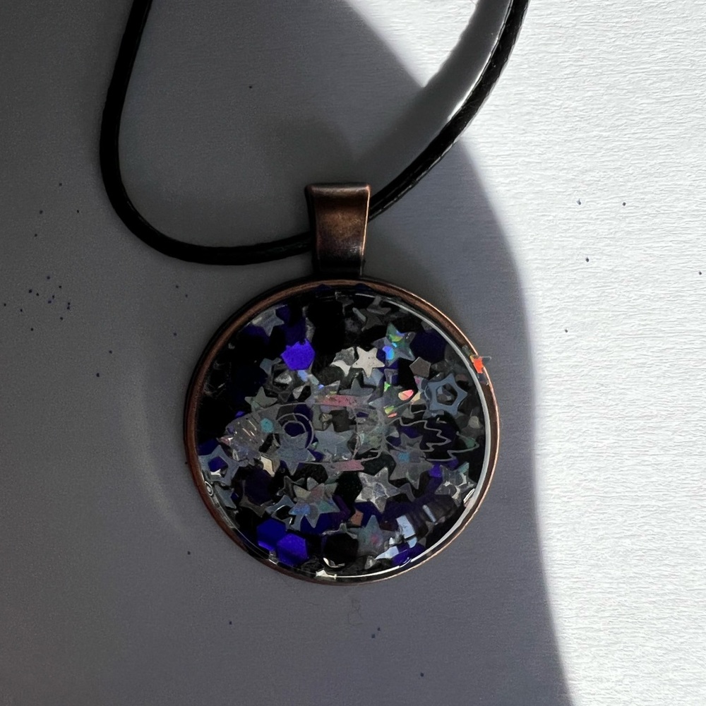 Space ship necklace